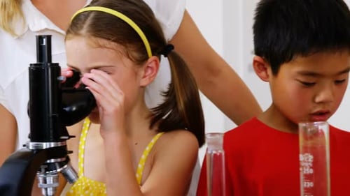 Children Learn Science Using Microscope in Classroom