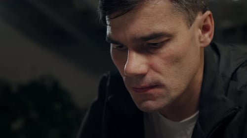 Close Up of Introspective Man Looking Down
