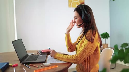 Young Woman Working Remotely on Laptop