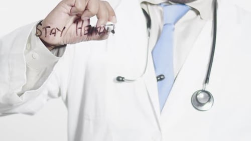 Doctor Writes Stay Healthy Message