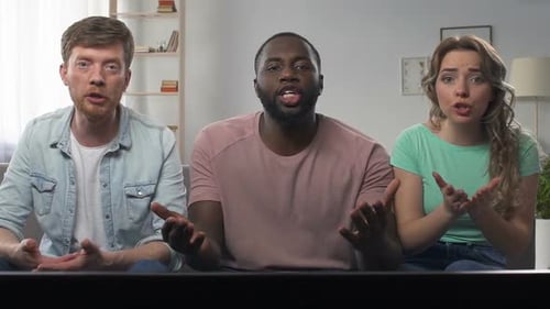 Excited Friends Cheerfully Watching Television Together