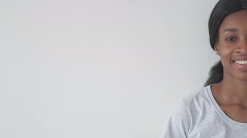 Smiling Woman Gives OK Hand Gesture