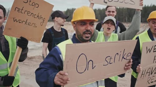 Construction Workers on Strike Hold Protest Signs