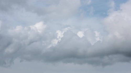 Dramatic Clouds Rolling Across Open Sky