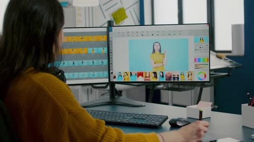 Woman Photo Editing with Graphic Tablet in Office