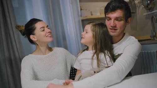 Family Talking at Table in Home Setting