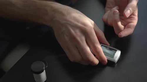 Final Part of a Person Testing Blood Sugar