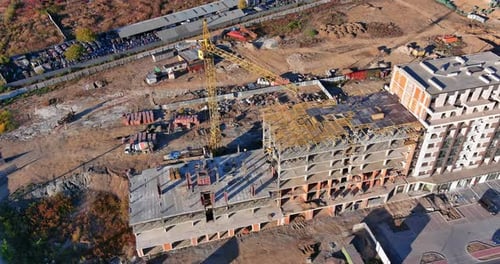 Aerial Top View of Construction Site New Multistorey Buildings Tower Crane with Unfinished Highrise