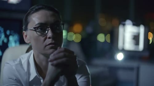 Female IT Programmer Working in Dark Office