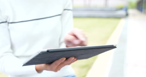 Woman working on tablet computer