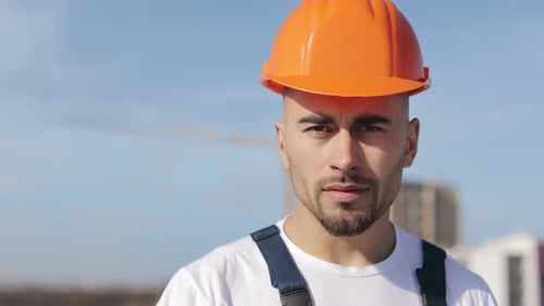 Portrait of a Serious Engineer Who is Looking at the Camera