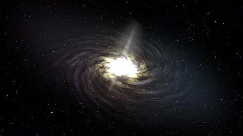 A spinning spiral galaxy surrounded by distant stars