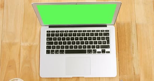 Laptop on Desk with Green Screen