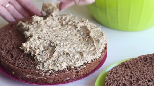 Preparing Chocolate Cake With Creamy Icing Close Up
