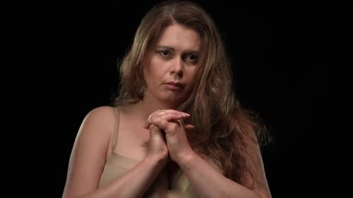 Front View Portrait Sad Depressed Overweight Woman in Bra Holding Hands Together Looking at Camera