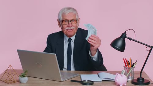 Senior Business Office Man Analyzes Financial Charts Celebrate Success Win at Home Workplace Desk