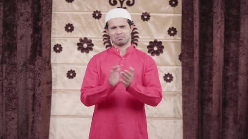 Muslim man clapping