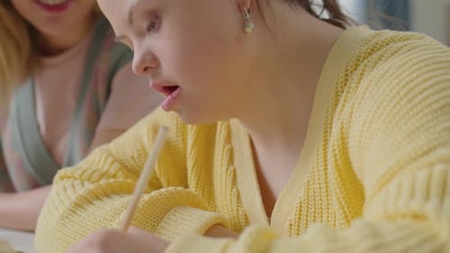 Young Woman Drawing with Friend Helping