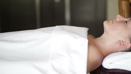 Woman Receiving Body Treatment