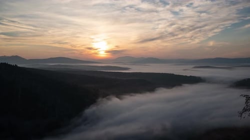 Sunrise Over Foggy Valley in Mountains
