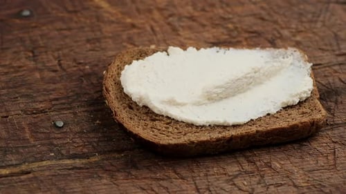 Creamy Spread on a Slice of Brown Bread