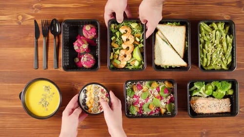 Food Delivery Top View Take Away Meals in Disposable Containers on Wooden Table