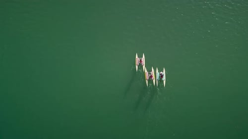 Aerial view people on water bike pedal boats in Greece.