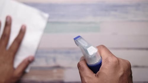 Hand Sprays Sanitizer on Cleaning Cloth