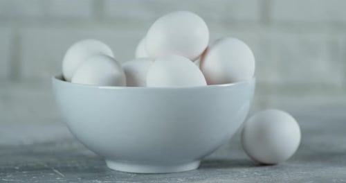 Bowl with Raw Eggs Slowly Rotates.
