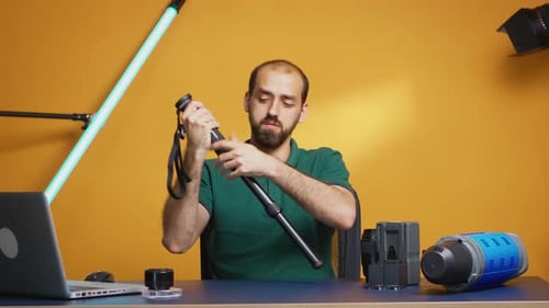 Adult Demonstrates Monopod Features in Studio