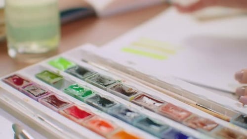 Woman Painting with Yellow Watercolors