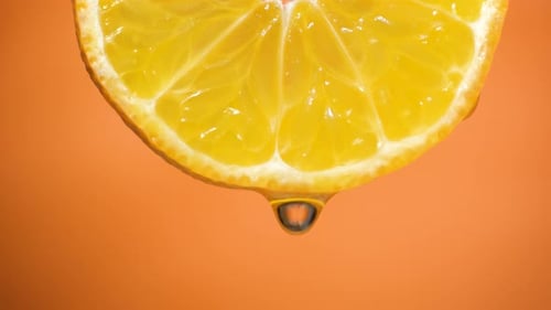 Water Dropping on an Orange Slice , Fruit for Diet and Healthy Food. Orange Backgrond