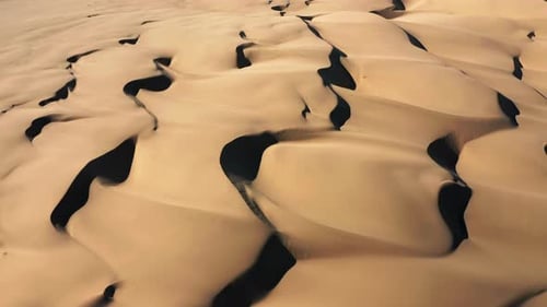 Aerial Top Down on the Waiving Pattern on Sand Dunes. Nature and Climate