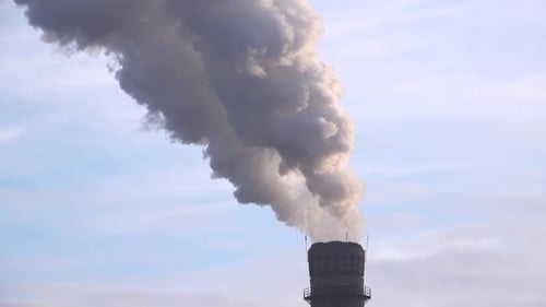 Smoke Stack with a Nice Smoke Over Blue Sky 001