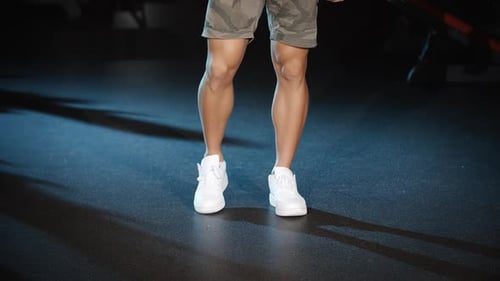 Handsome Man Workout Trains Legs Joins and Knees Circle Exercises