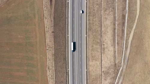Cars and Trucks Driving on a Highway