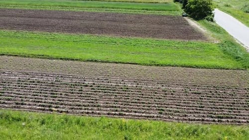 Aerial drone view of a flying over the rural agricultural landscape.