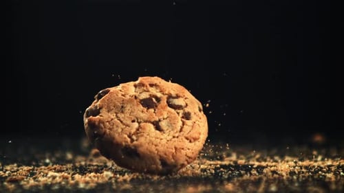 Cookies with Pieces of Chocolate Fall on the Table
