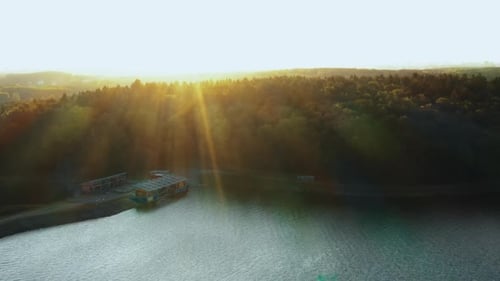 Gorgeous Nature and Urban Skyline, Drone Turning Right Over Calm Autumn Lake and Green Forest