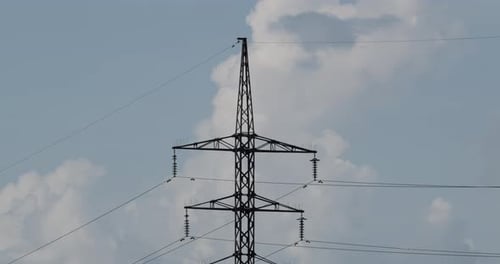 High Voltage Electric Tower On A Background Of Blue Sky