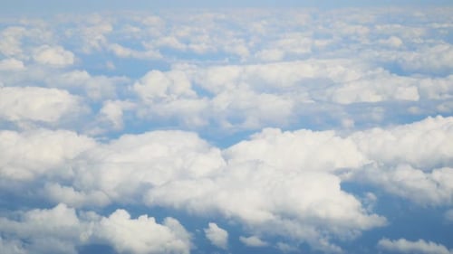 Scenic Aerial View of White Clouds and Blue Sky
