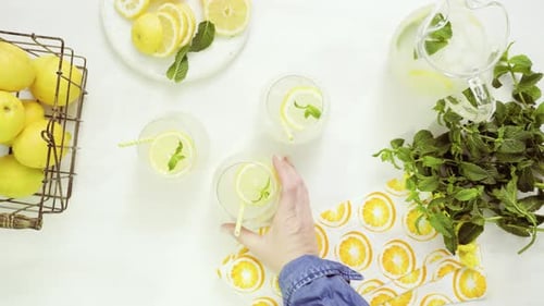 Refreshing Lemonade with Mint on a Bright Table