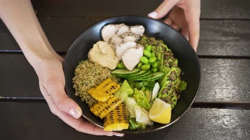 Rotating Black Bowl of Delicious Healthy Salad