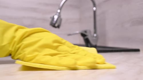 Yellow Glove Cleaning Counter With Cloth
