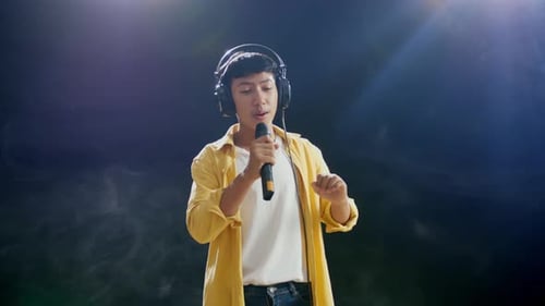 Stylish Singer Performing on Stage with Microphone