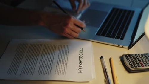 Tax Declaration Work at Night by Laptop