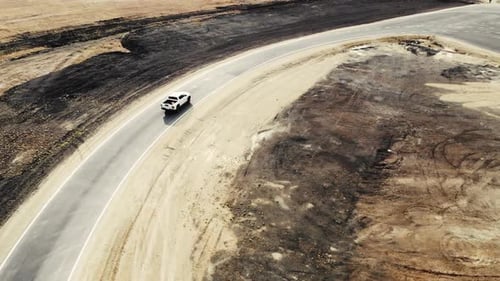 Aerial View of Pickup Truck That Drives Along Track of Proving Ground