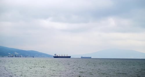 Freight Vessels Sail Along Sea Water Near Local Harbour
