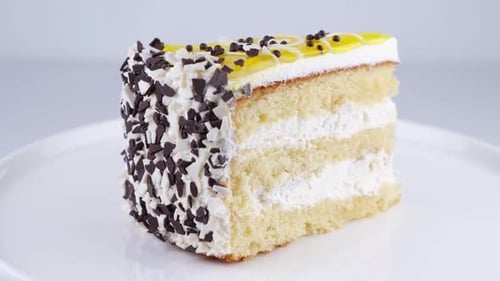 Delicious Layered Cake Slice with Chocolate Shavings