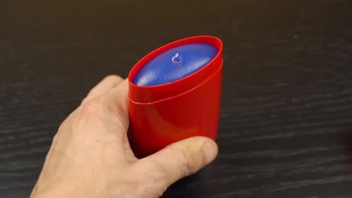 A man's hand opens and twists dry deodorant. freshness, the smell!